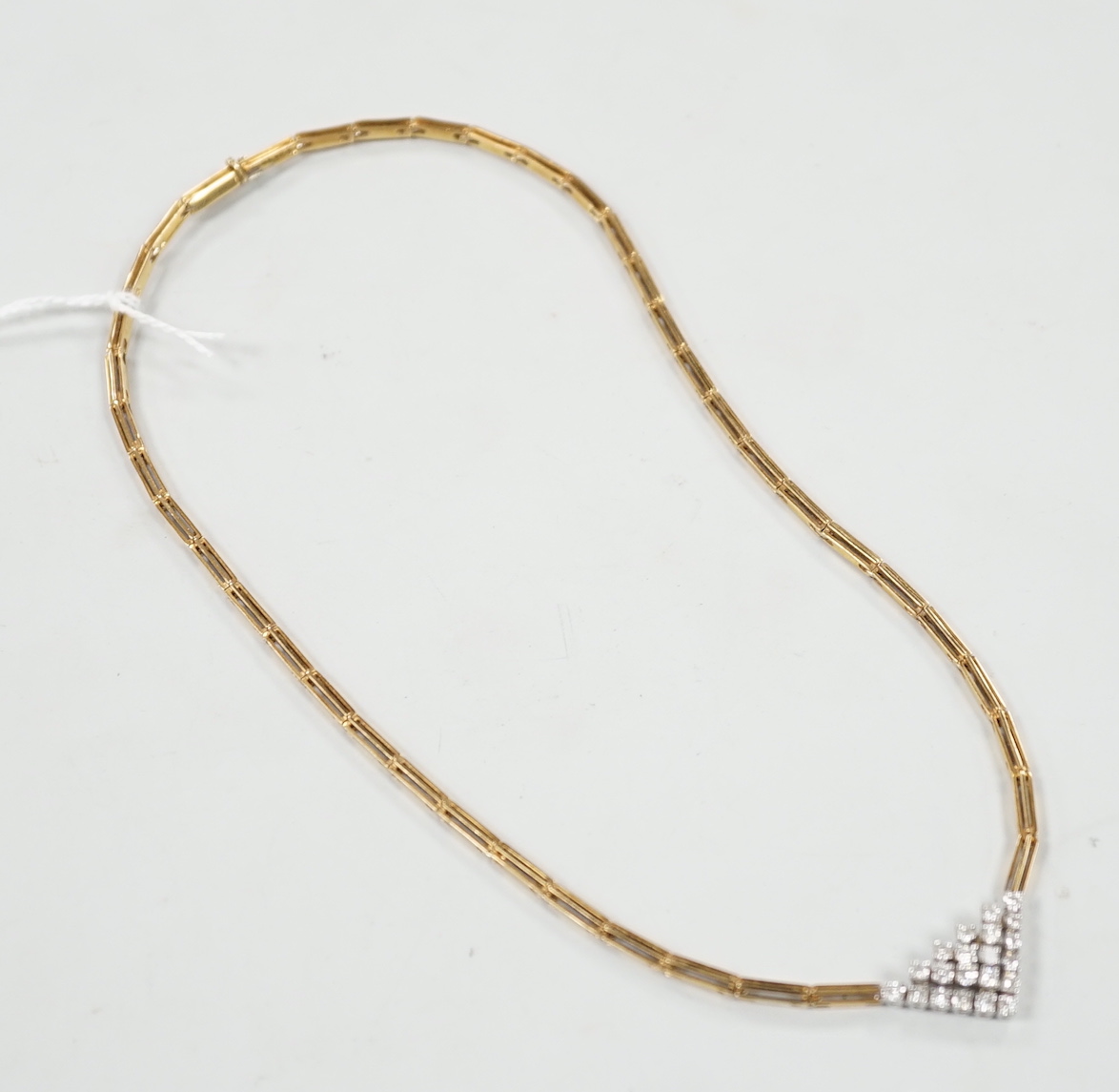 A modern 14kt yellow metal gold diamond cluster set V shaped necklace, approx. 40cm, gross weight 19 grams.